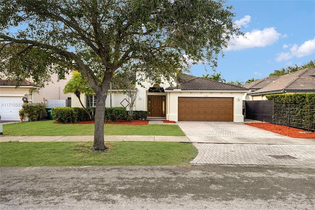 mediterranean / spanish-style home with a front yard