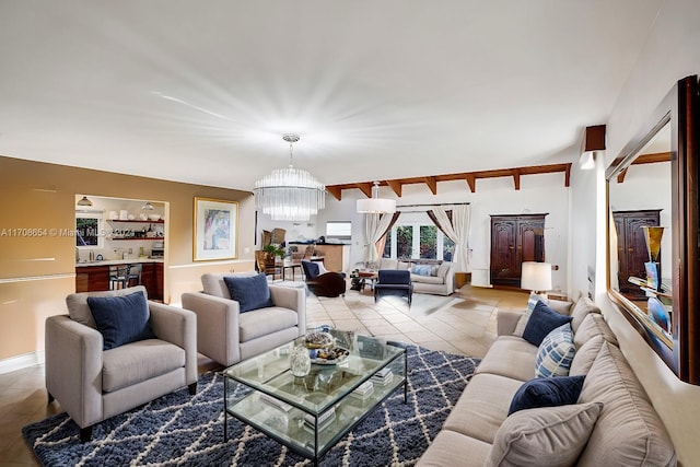 living room with light tile patterned floors and a chandelier