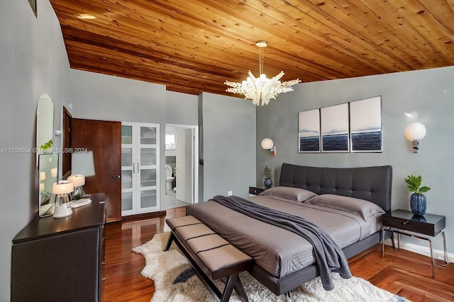 bedroom with wood ceiling, dark hardwood / wood-style floors, and vaulted ceiling