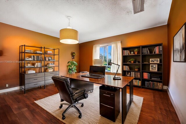 office area featuring a textured ceiling and dark hardwood / wood-style floors