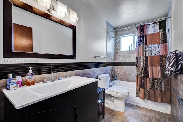 full bathroom featuring vanity, toilet, tile walls, and shower / bath combo with shower curtain