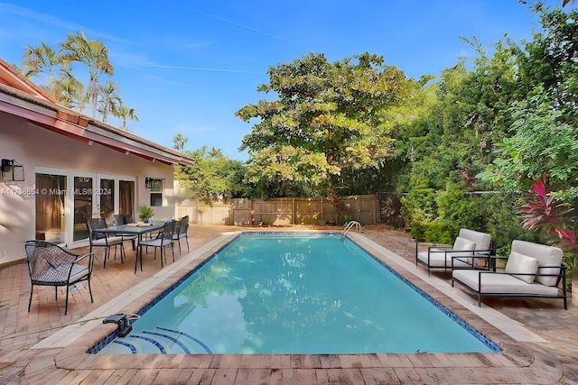 view of pool featuring a patio