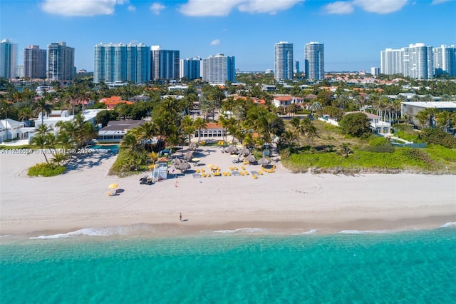 aerial view with a beach view and a water view