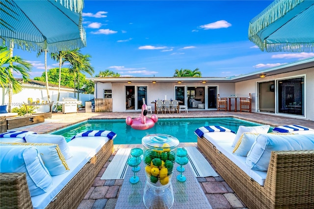 view of swimming pool with a patio