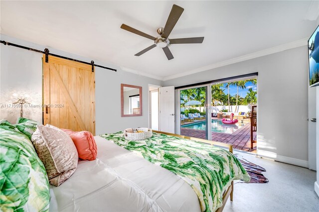 bedroom with a barn door, ceiling fan, ornamental molding, and access to exterior