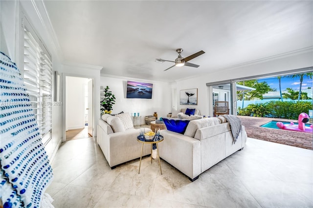 living room with ceiling fan and crown molding