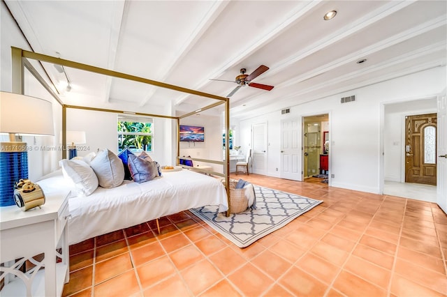 bedroom with beam ceiling, tile patterned floors, and ceiling fan