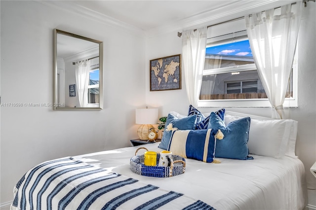 bedroom with ornamental molding