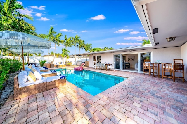 view of pool featuring a patio and an outdoor hangout area