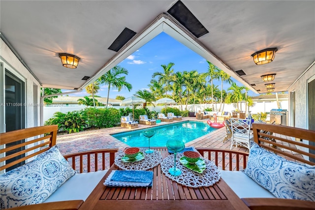 view of pool featuring an outdoor hangout area and a patio