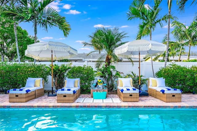 view of swimming pool featuring a patio area