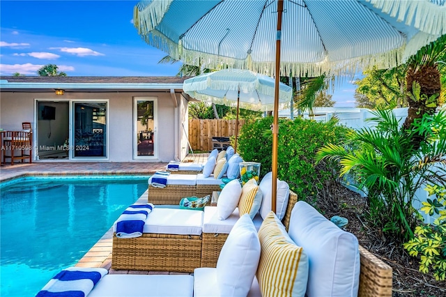 view of pool with an outdoor living space