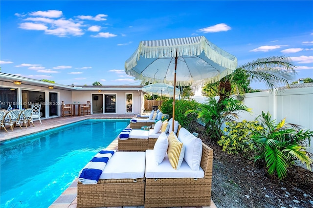 view of pool with outdoor lounge area and a patio area