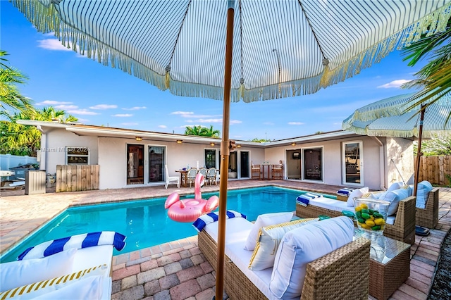 view of swimming pool with an outdoor hangout area and a patio