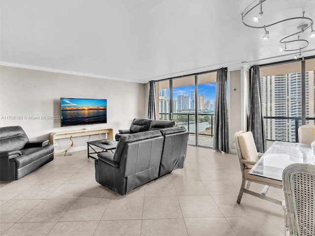 living room featuring floor to ceiling windows, crown molding, and light tile patterned flooring