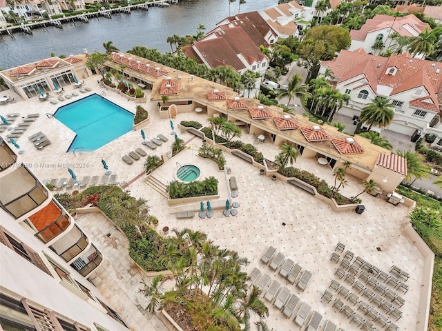 birds eye view of property featuring a water view