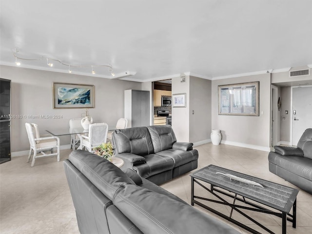 tiled living room featuring rail lighting and ornamental molding