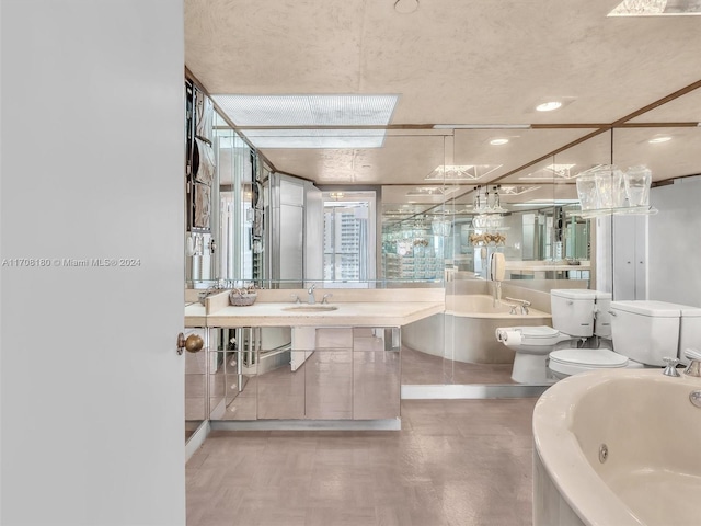 bathroom featuring sink, a washtub, and toilet