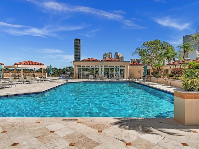 view of swimming pool with a gazebo and a patio area