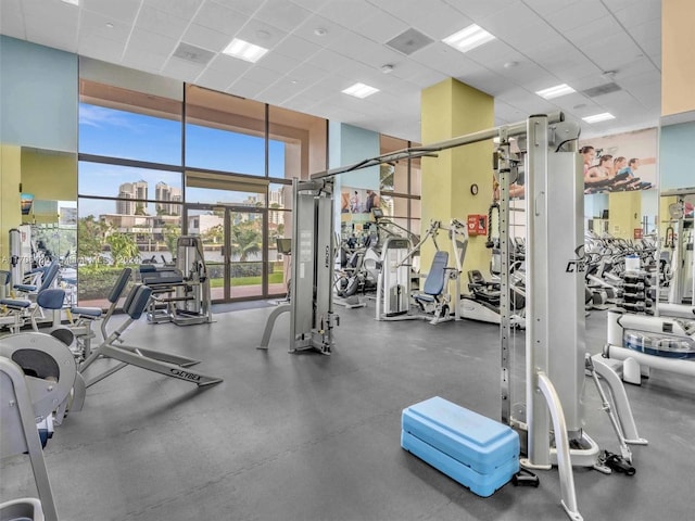 exercise room featuring a paneled ceiling