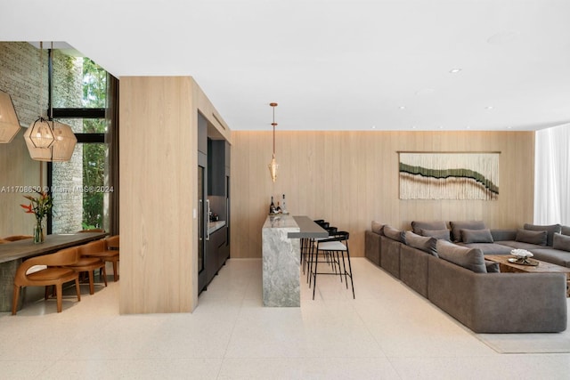 living room featuring wooden walls