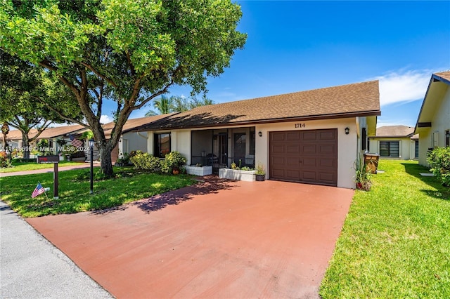 single story home featuring a front yard and a garage