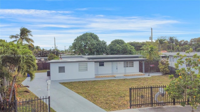 view of front of home featuring covered porch and a front lawn