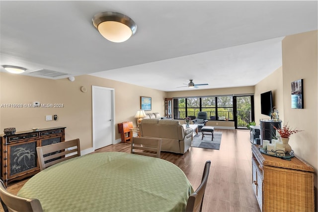 dining area featuring hardwood / wood-style floors and ceiling fan