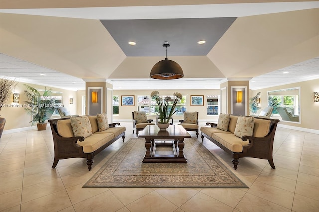 tiled living room with ornate columns, crown molding, and vaulted ceiling