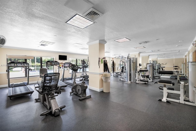 exercise room with a textured ceiling