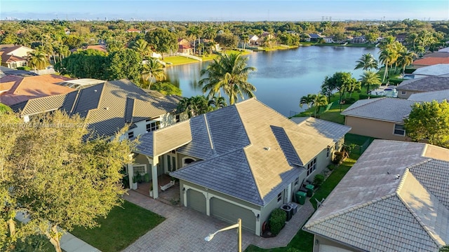 birds eye view of property with a water view