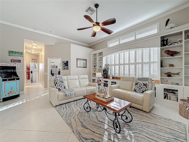 living room with a textured ceiling, ceiling fan, crown molding, and light tile patterned flooring