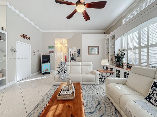 living room with crown molding, light tile patterned floors, a textured ceiling, and ceiling fan