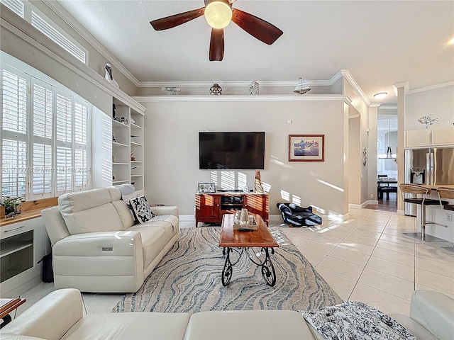 living room with light tile patterned floors, ceiling fan, and ornamental molding