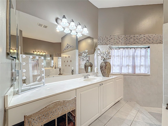 bathroom with tile patterned floors and vanity