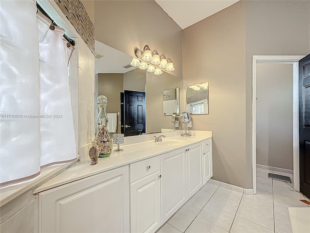 bathroom featuring tile patterned flooring and vanity