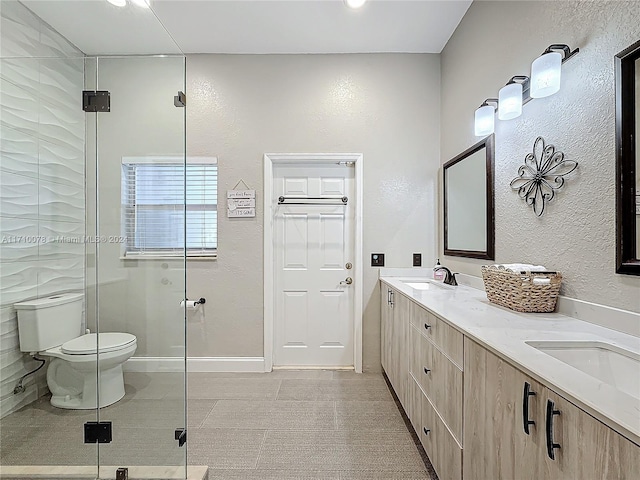 bathroom with toilet, vanity, tile patterned floors, and walk in shower