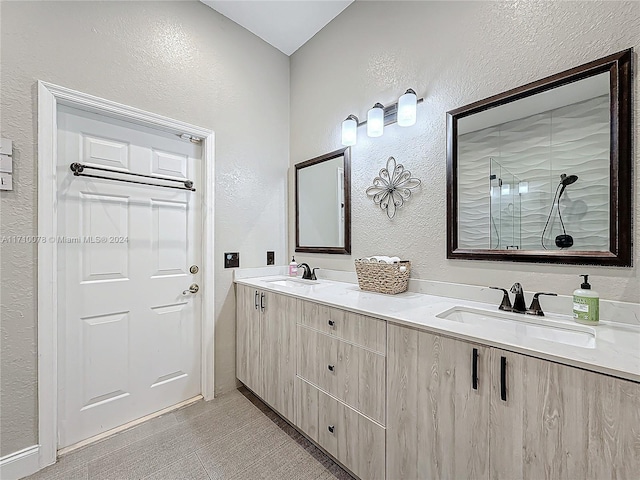 bathroom featuring vanity and an enclosed shower