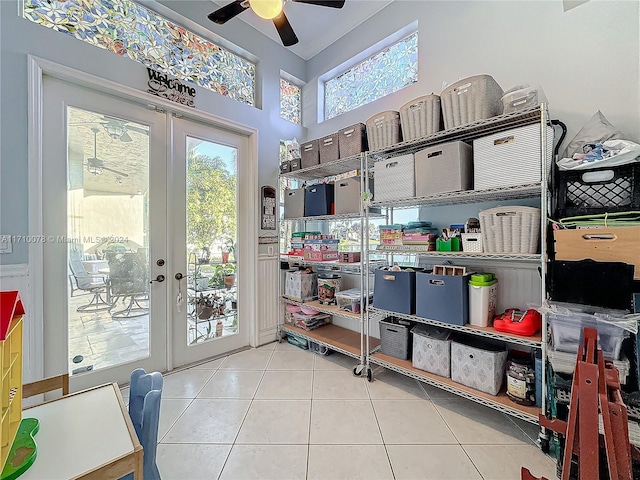 storage featuring ceiling fan and french doors