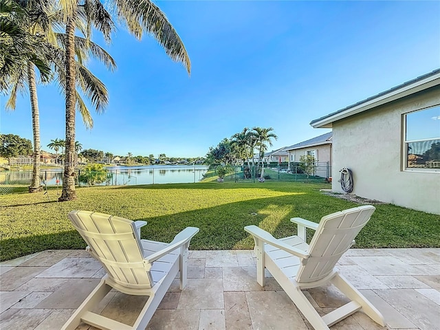 view of yard featuring a patio area and a water view