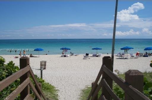 view of water feature with a beach view