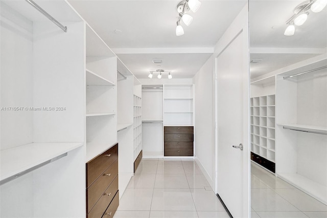 walk in closet featuring light tile patterned floors