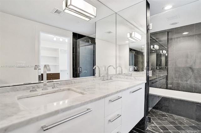 bathroom featuring vanity and walk in shower