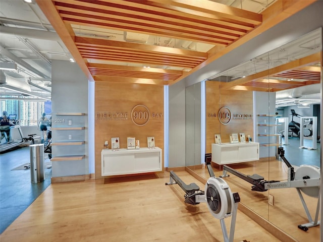 exercise room with hardwood / wood-style flooring