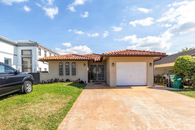 mediterranean / spanish house featuring a front lawn and a garage