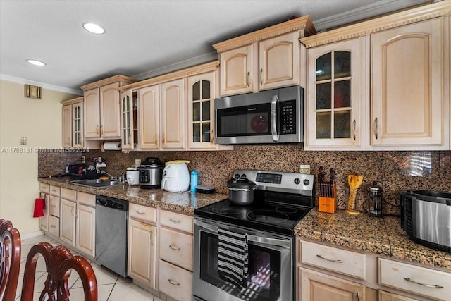 kitchen with sink, light brown cabinets, stainless steel appliances, light tile patterned flooring, and ornamental molding