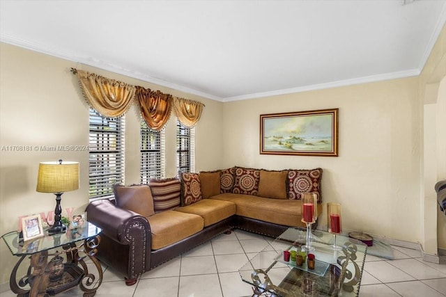 living room featuring ornamental molding and light tile patterned flooring