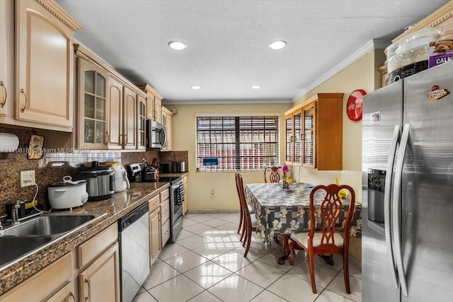 kitchen with sink, stainless steel appliances, decorative backsplash, light tile patterned floors, and ornamental molding