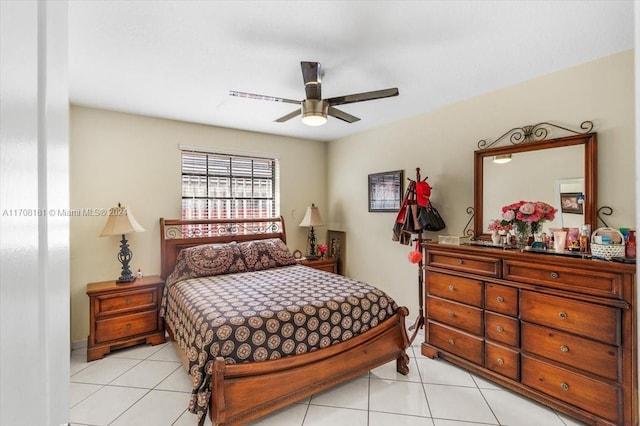 tiled bedroom with ceiling fan