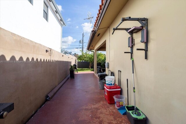 view of side of home with a patio